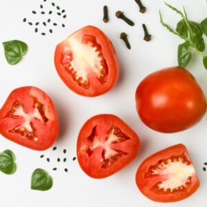 Tomatoes with green leaves around it