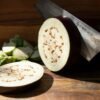 cutted brinjal with a knife on it