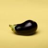 round brinjal with yellow background