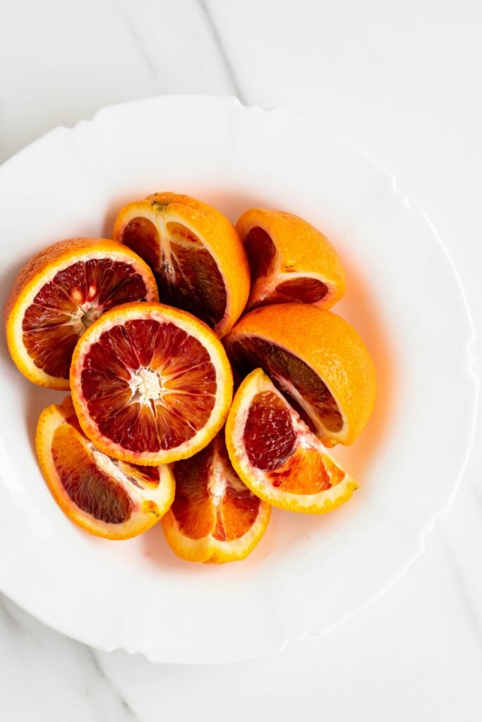 sliced oranges in a white plate